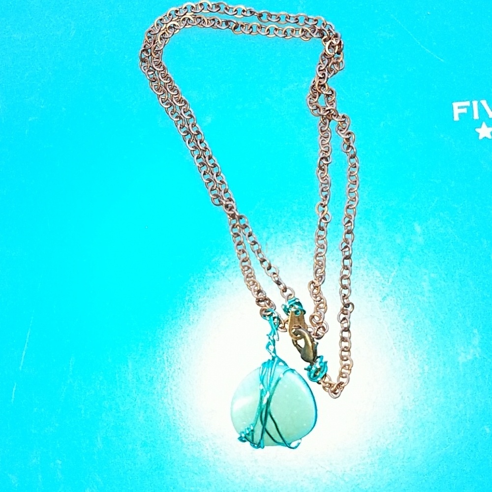 Handmade necklace with turquoise colored stone